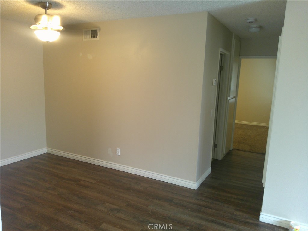 8990 19th Street, Unit 286 Rancho Cucamonga, CA 91701 - Photo 5 of 10 a view of a room with wooden floor