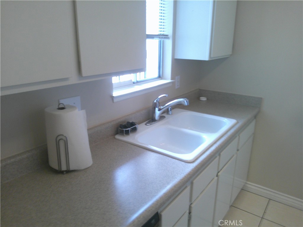 8990 19th Street, Unit 286 Rancho Cucamonga, CA 91701 - Photo 7 of 10 a bathroom with a sink and a mirror