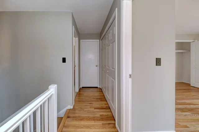 a bathroom with a granite countertop toilet a sink and a bathtub