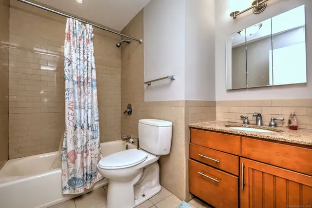 a kitchen with a refrigerator and a stove