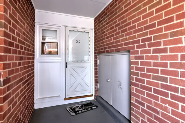 a view of an empty room with glass door