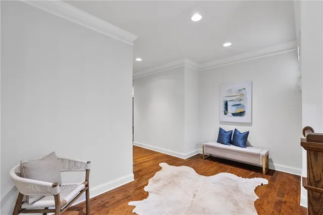 a bedroom with furniture and a rug