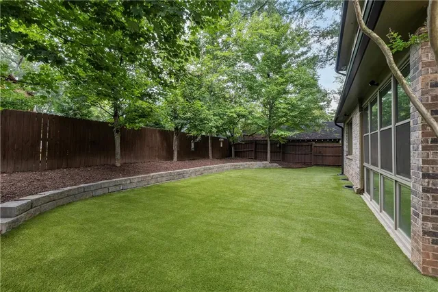 a view of a small house with garage