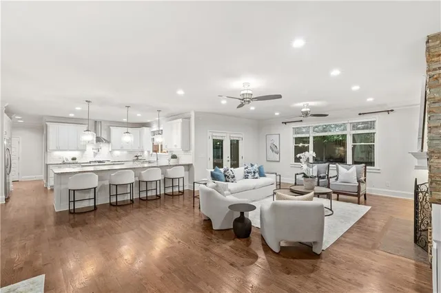 a living room with kitchen island furniture and a kitchen view