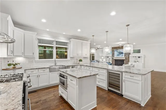 a kitchen with a sink stove and cabinets
