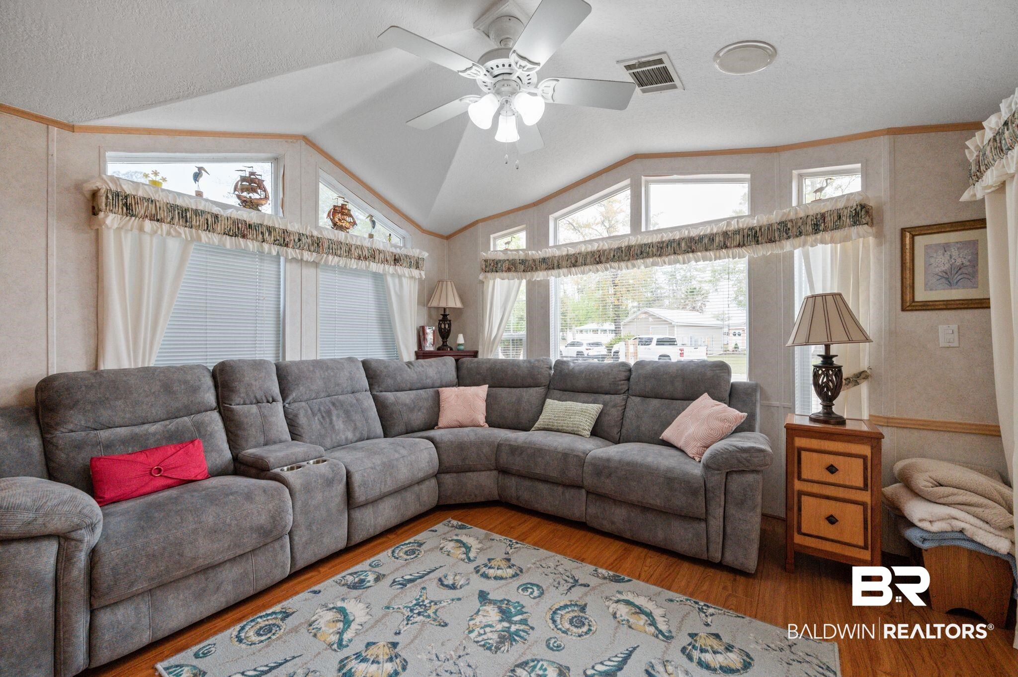 24711 County Road 20, Unit A11 Elberta, AL 36530 - Photo 5 of 35 Living area with a ceiling fan, light wood-style floors, and plenty of natural light