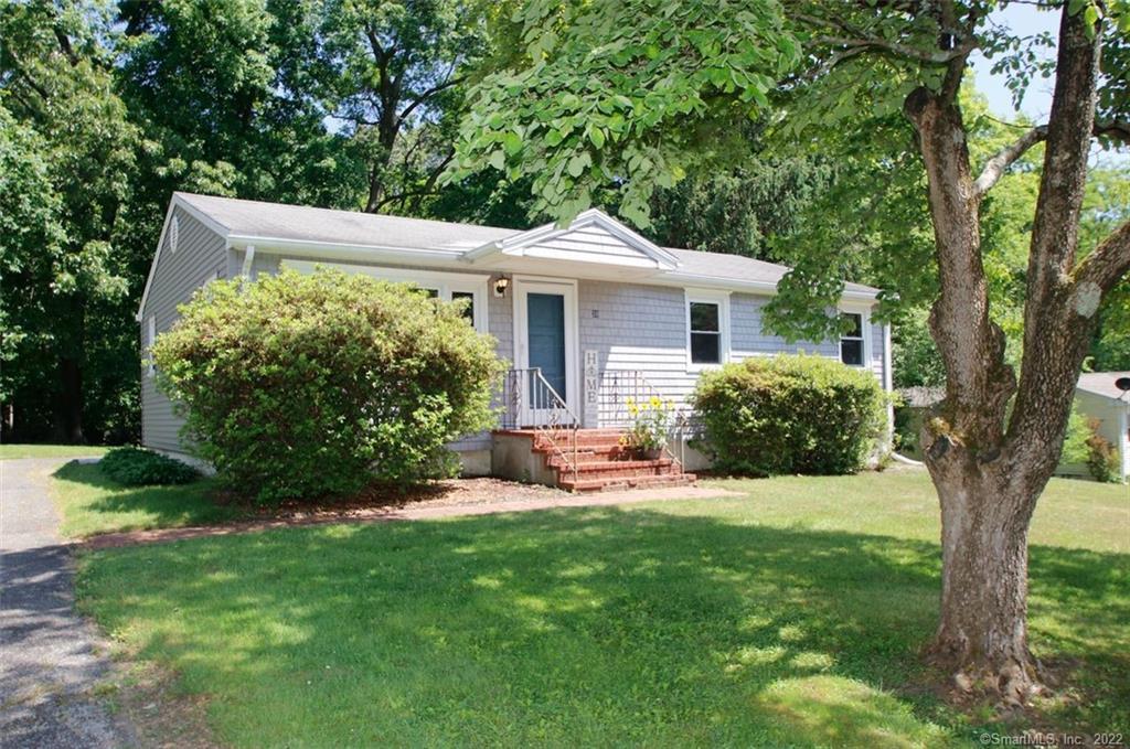 a view of a house with a yard