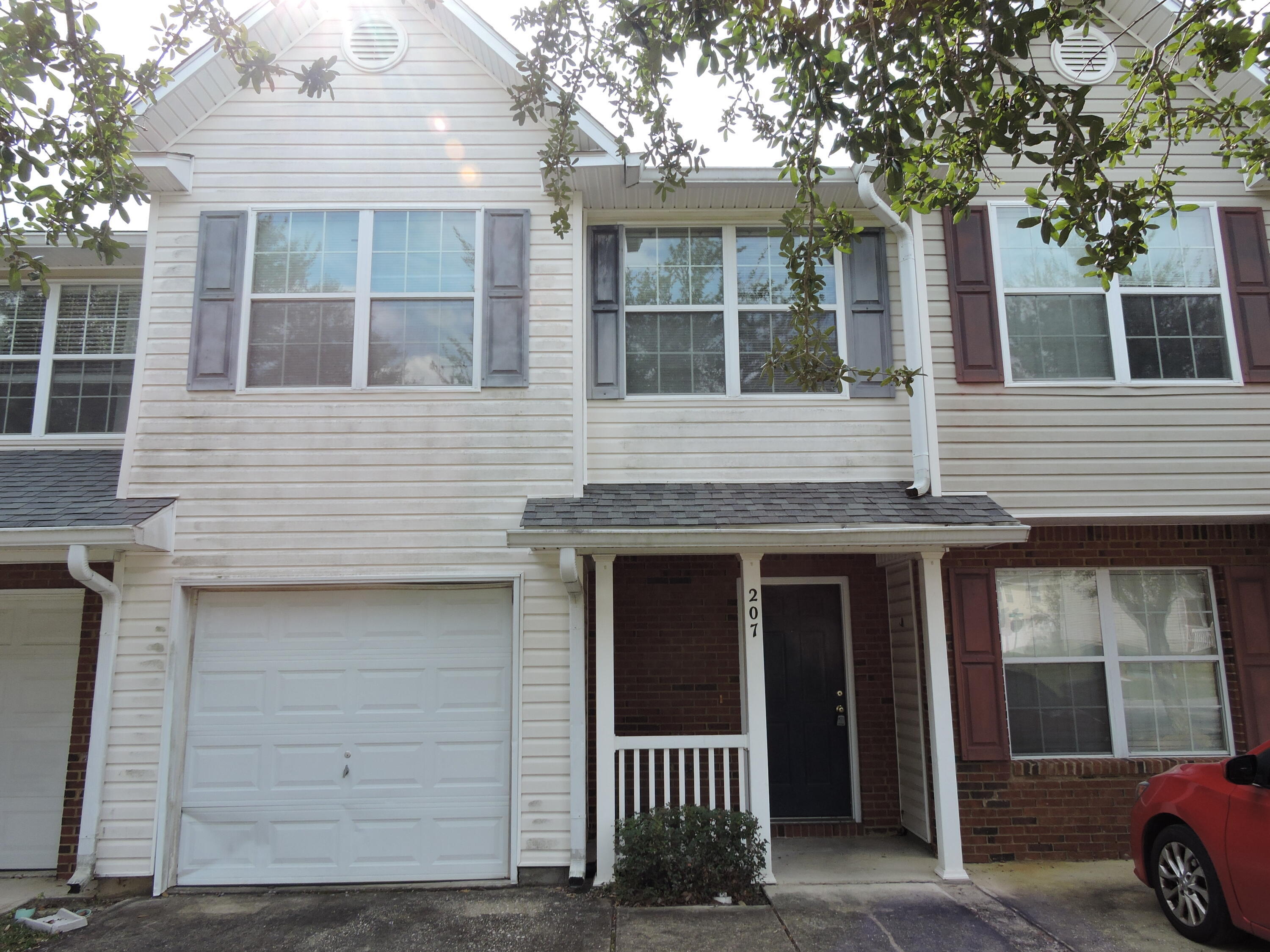 207 Swaying Pine Court Crestview, FL 32539 - Photo 1 of 15 a view of a house with a door and a window