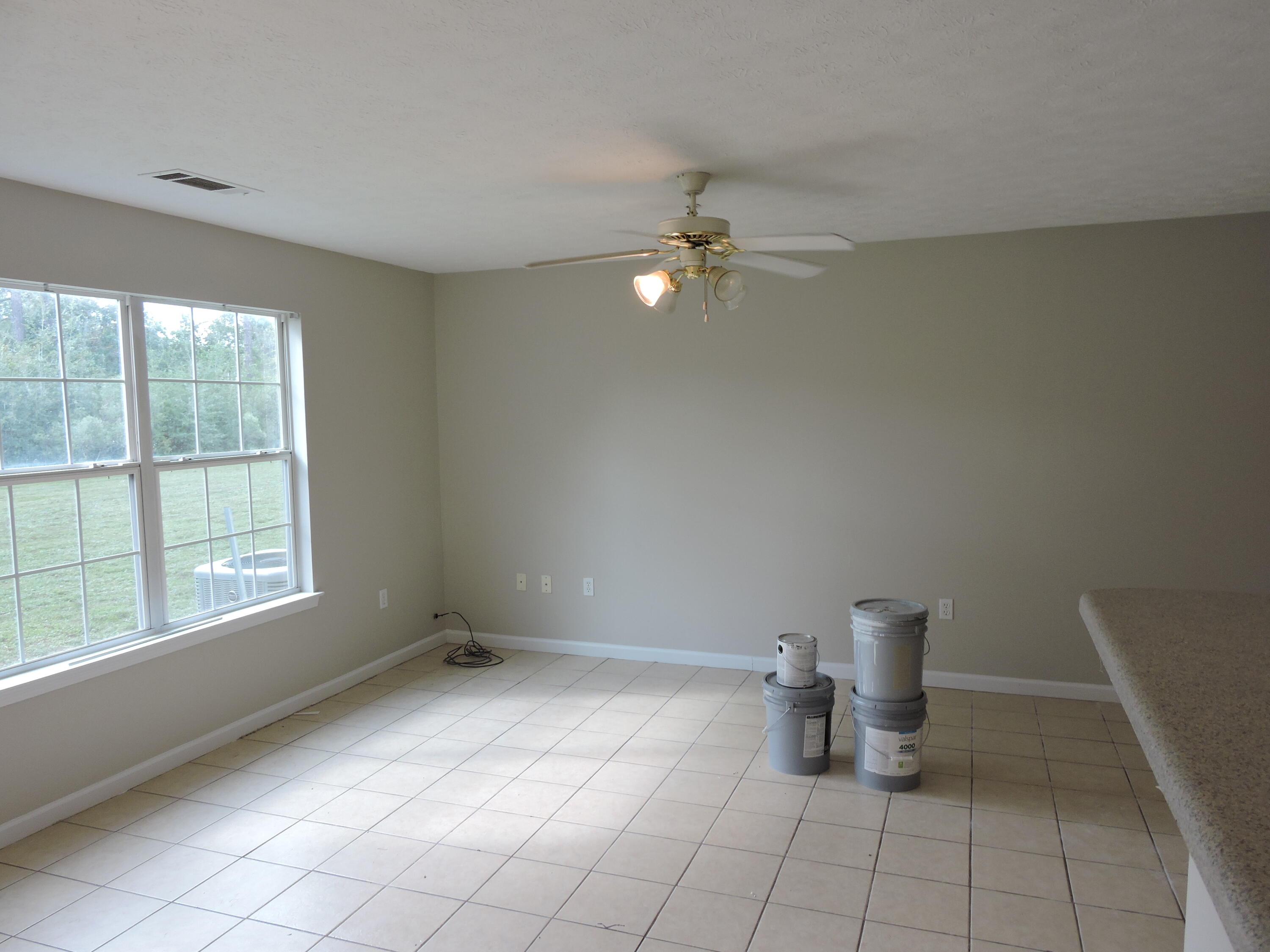 207 Swaying Pine Court Crestview, FL 32539 - Photo 4 of 15 a view of an empty room with a window
