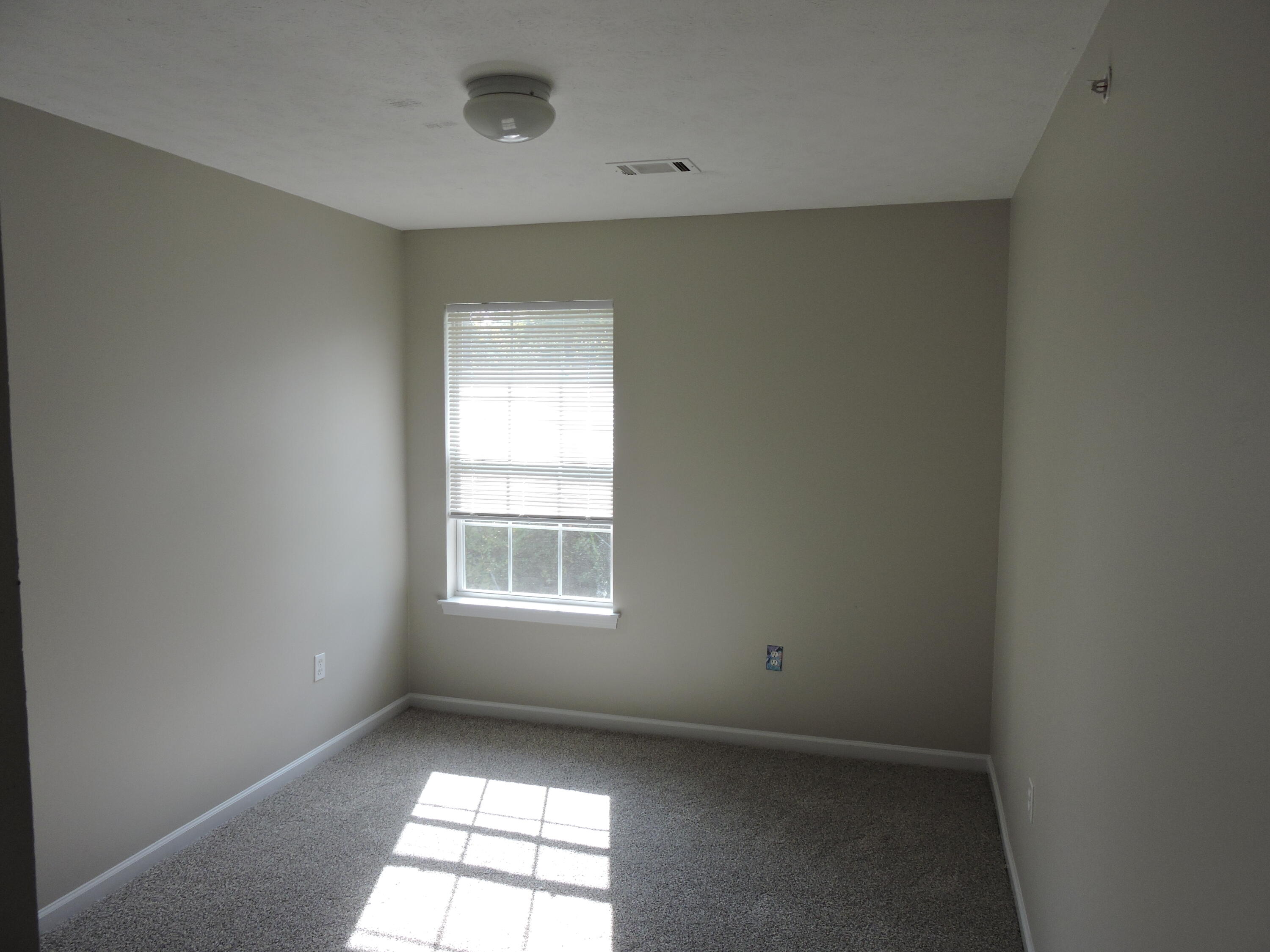 207 Swaying Pine Court Crestview, FL 32539 - Photo 9 of 15 an empty room with a window