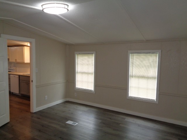 15120 Capitol Hill Road Montgomery, TX 77316 - Photo 4 of 17 a view of an empty room with wooden floor and a window