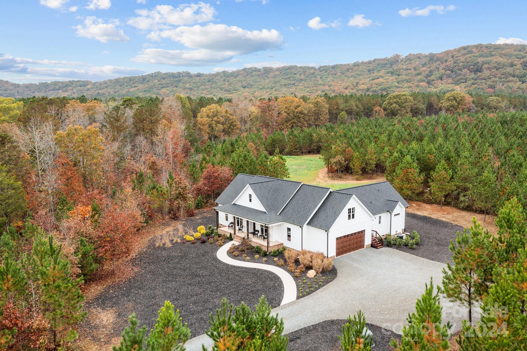 450 Bringle Ferry Road Denton, NC 27239 - Photo 1 of 48 an aerial view of a house with a garden