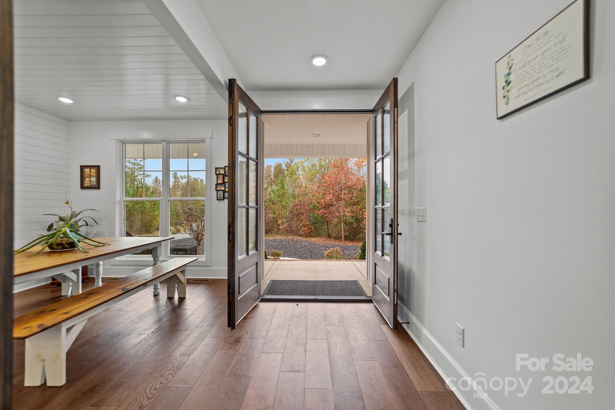 450 Bringle Ferry Road Denton, NC 27239 - Photo 11 of 48 a view of a large hall with wooden floor and windows