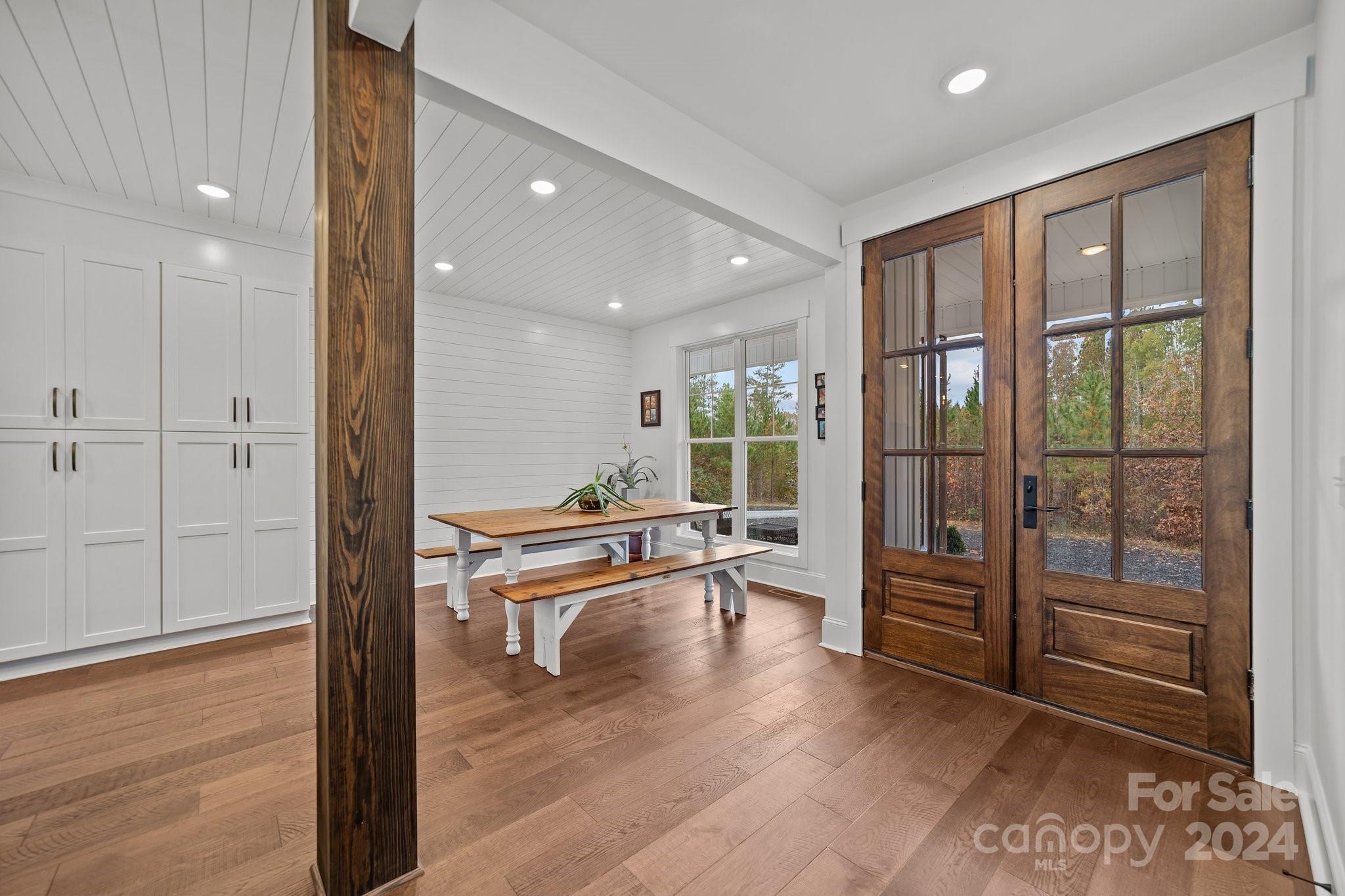 450 Bringle Ferry Road Denton, NC 27239 - Photo 12 of 48 a view of a hallway with wooden floor and a bathroom