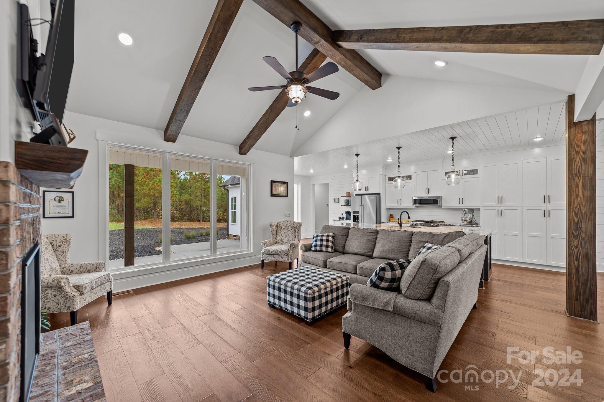 450 Bringle Ferry Road Denton, NC 27239 - Photo 16 of 48 a living room with furniture and a large window