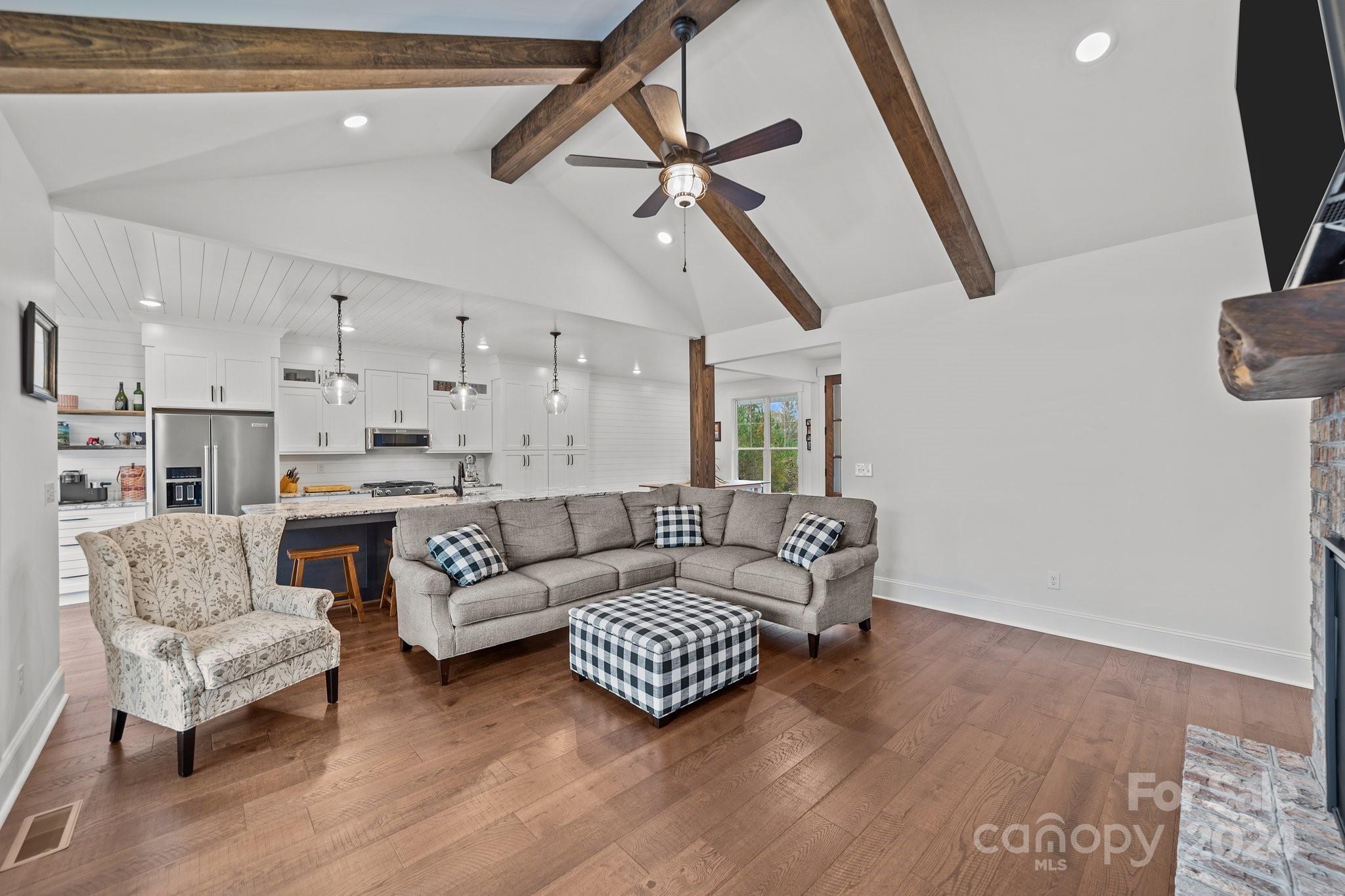 450 Bringle Ferry Road Denton, NC 27239 - Photo 17 of 48 a living room with furniture and a wooden floor