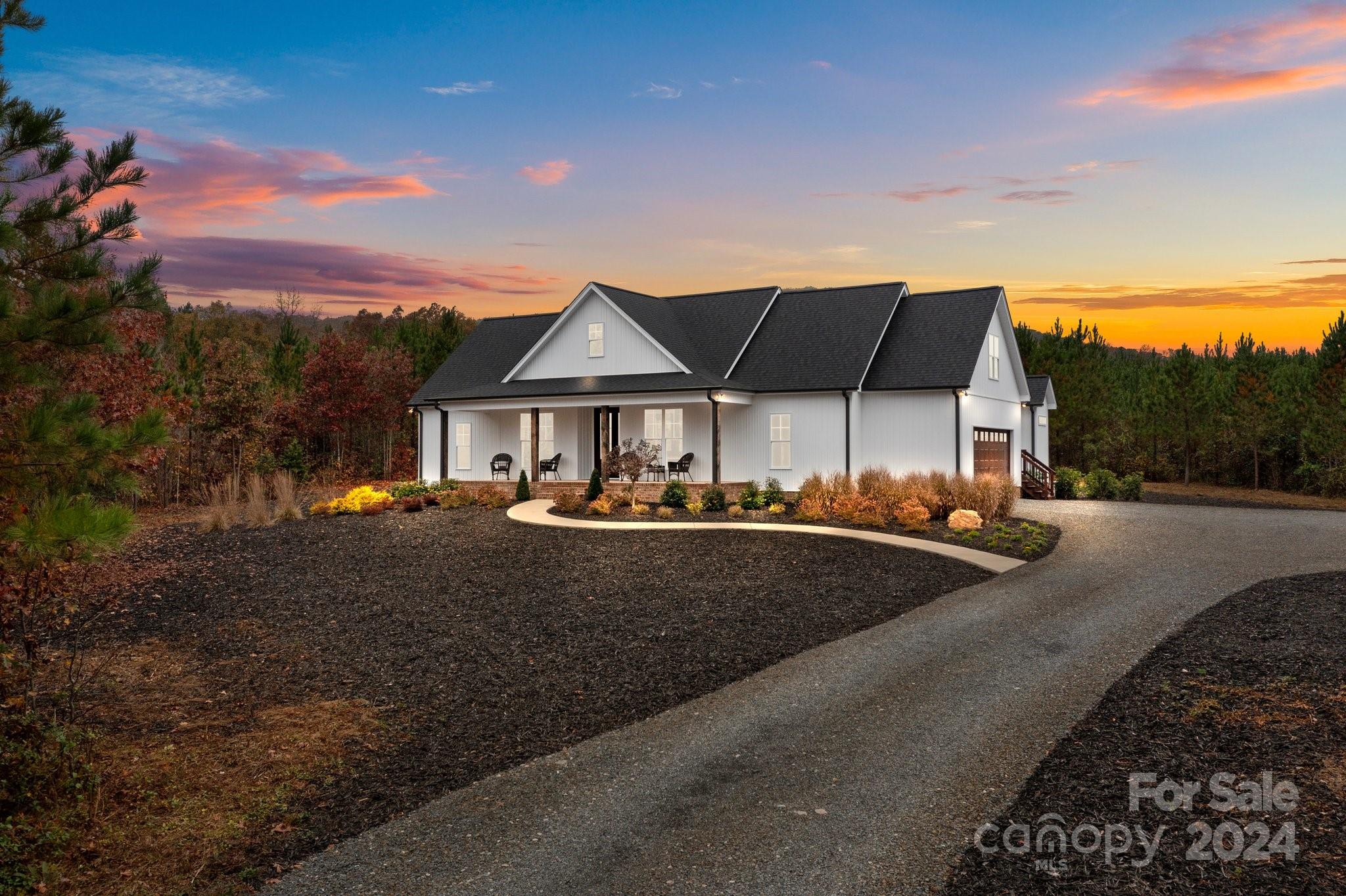 450 Bringle Ferry Road Denton, NC 27239 - Photo 2 of 48 a front view of a house with yard