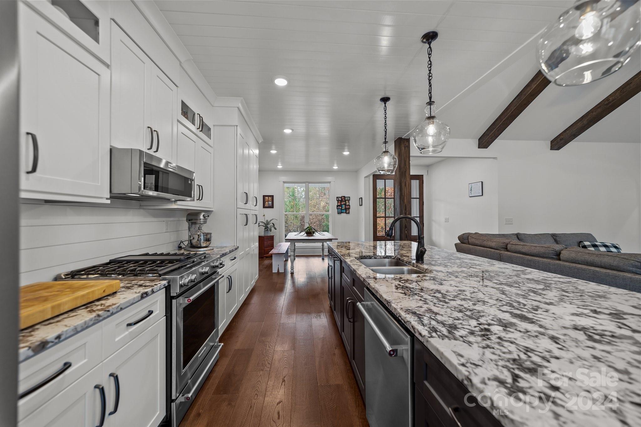 450 Bringle Ferry Road Denton, NC 27239 - Photo 24 of 48 a kitchen with stainless steel appliances granite countertop a sink stove and refrigerator
