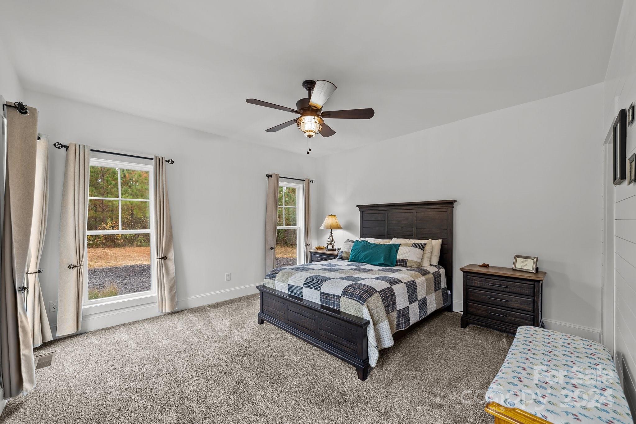 450 Bringle Ferry Road Denton, NC 27239 - Photo 28 of 48 a bedroom with a bed dresser and a window