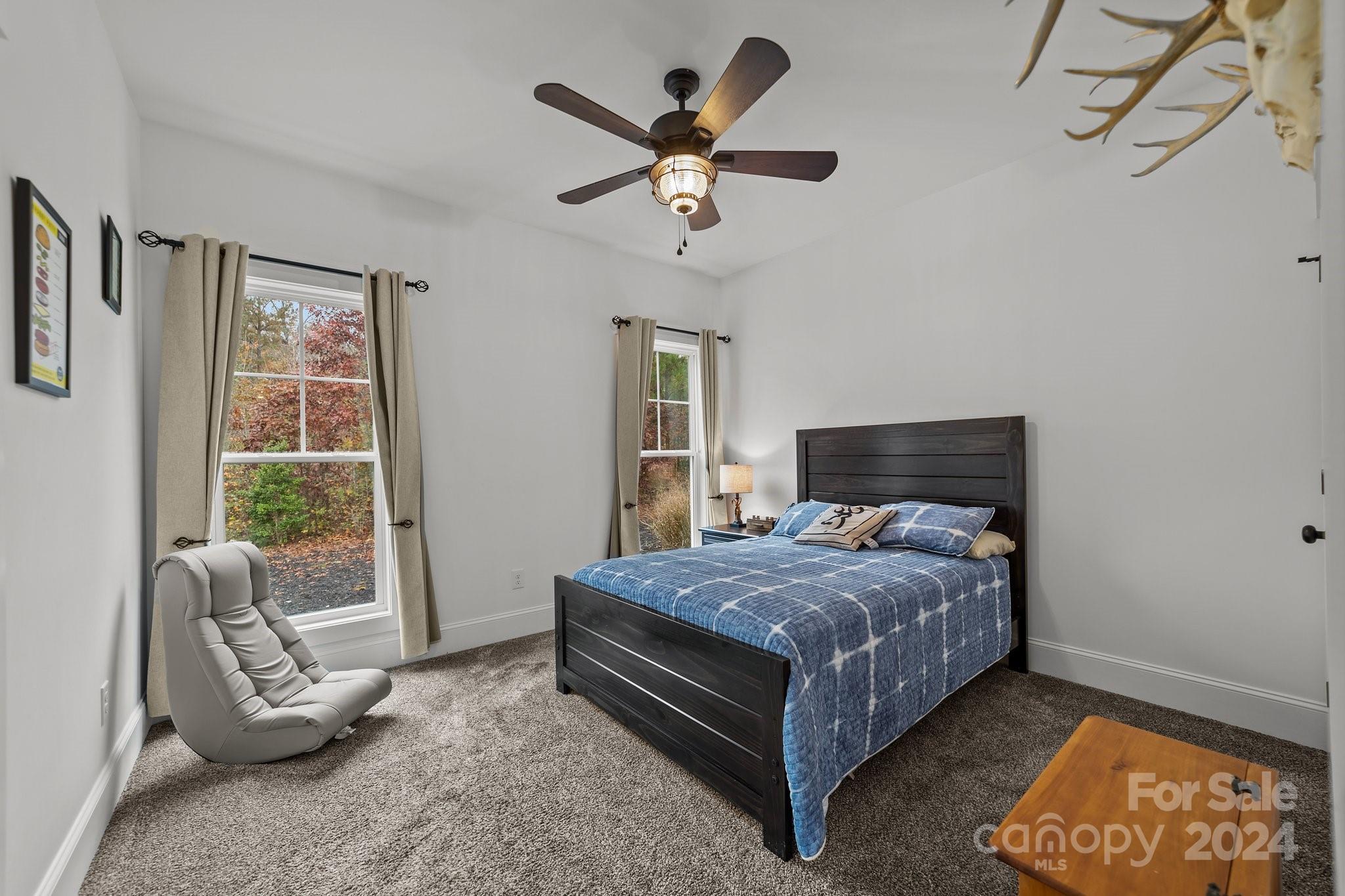 450 Bringle Ferry Road Denton, NC 27239 - Photo 36 of 48 a bedroom with a bed and window