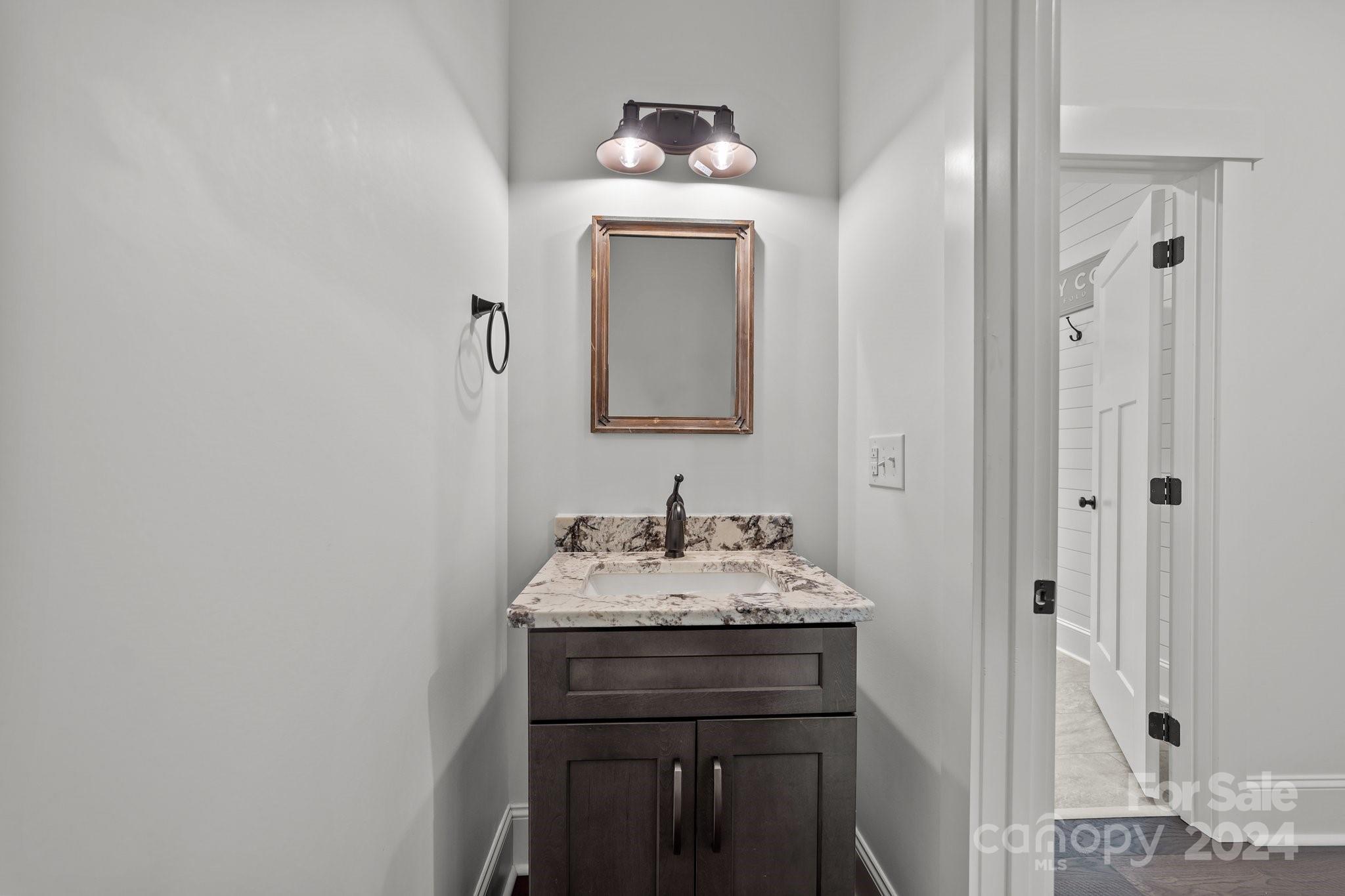 450 Bringle Ferry Road Denton, NC 27239 - Photo 40 of 48 a bathroom with a sink and a mirror