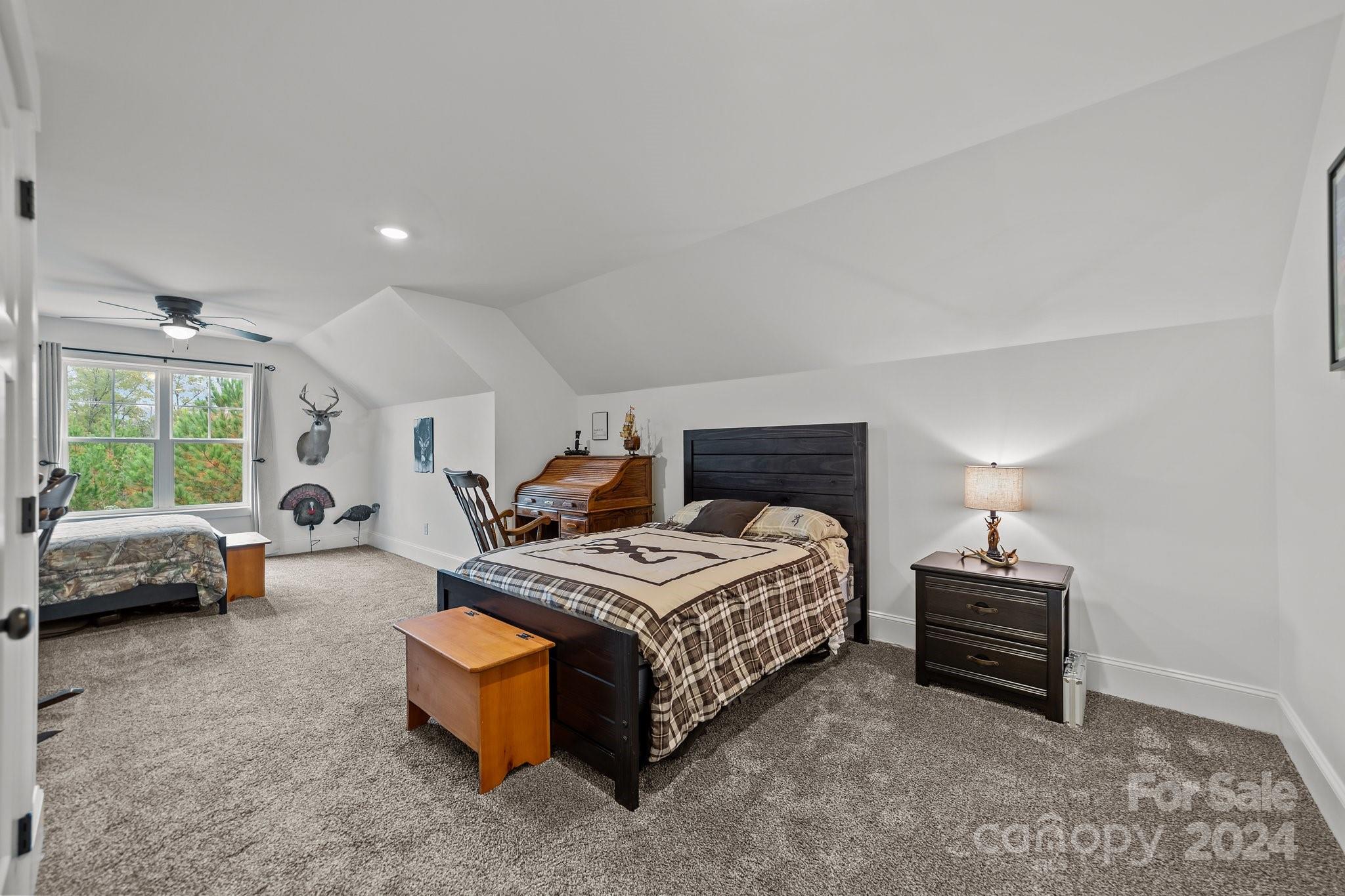 450 Bringle Ferry Road Denton, NC 27239 - Photo 41 of 48 a bedroom with furniture and a window