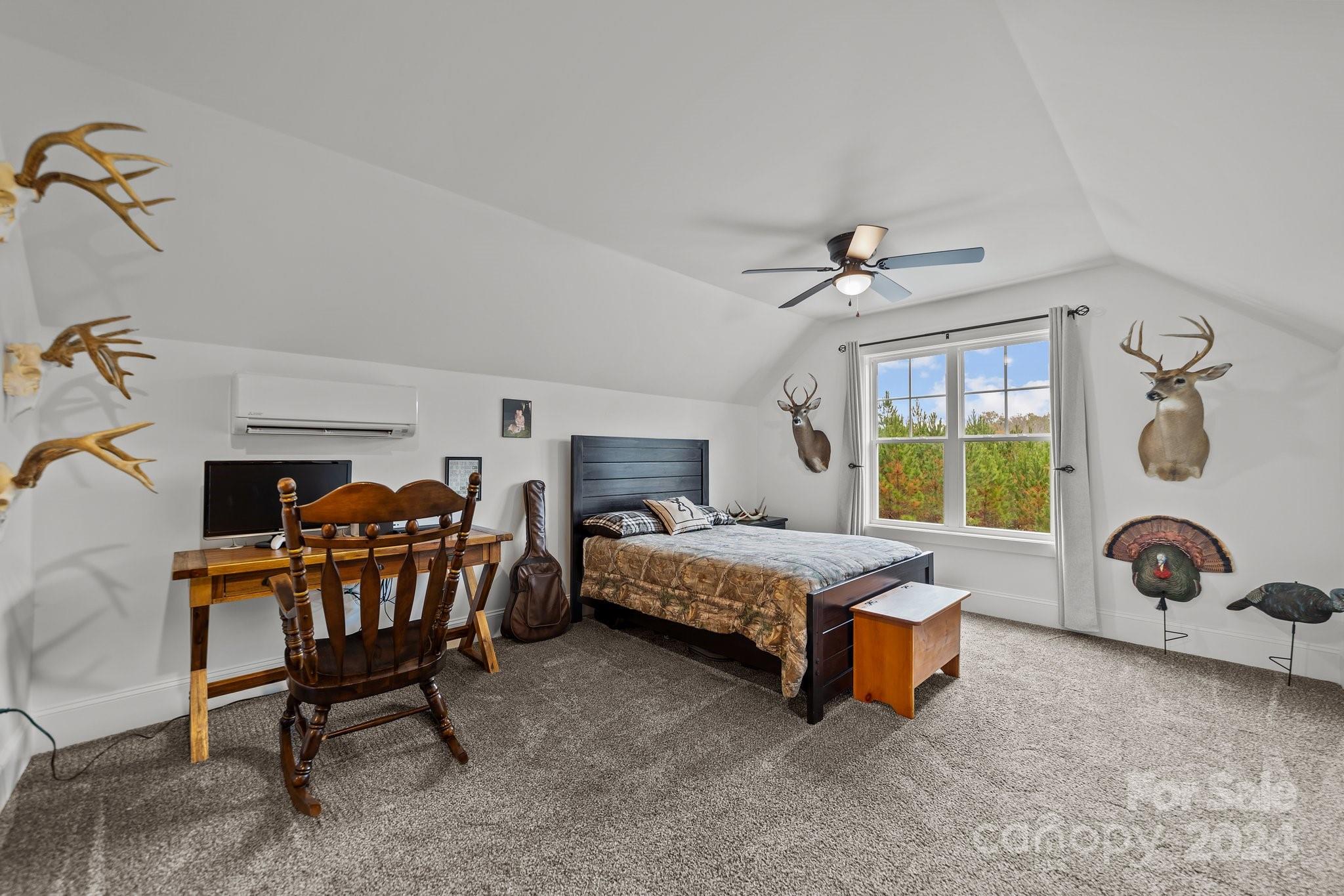 450 Bringle Ferry Road Denton, NC 27239 - Photo 42 of 48 a bedroom with furniture and a window