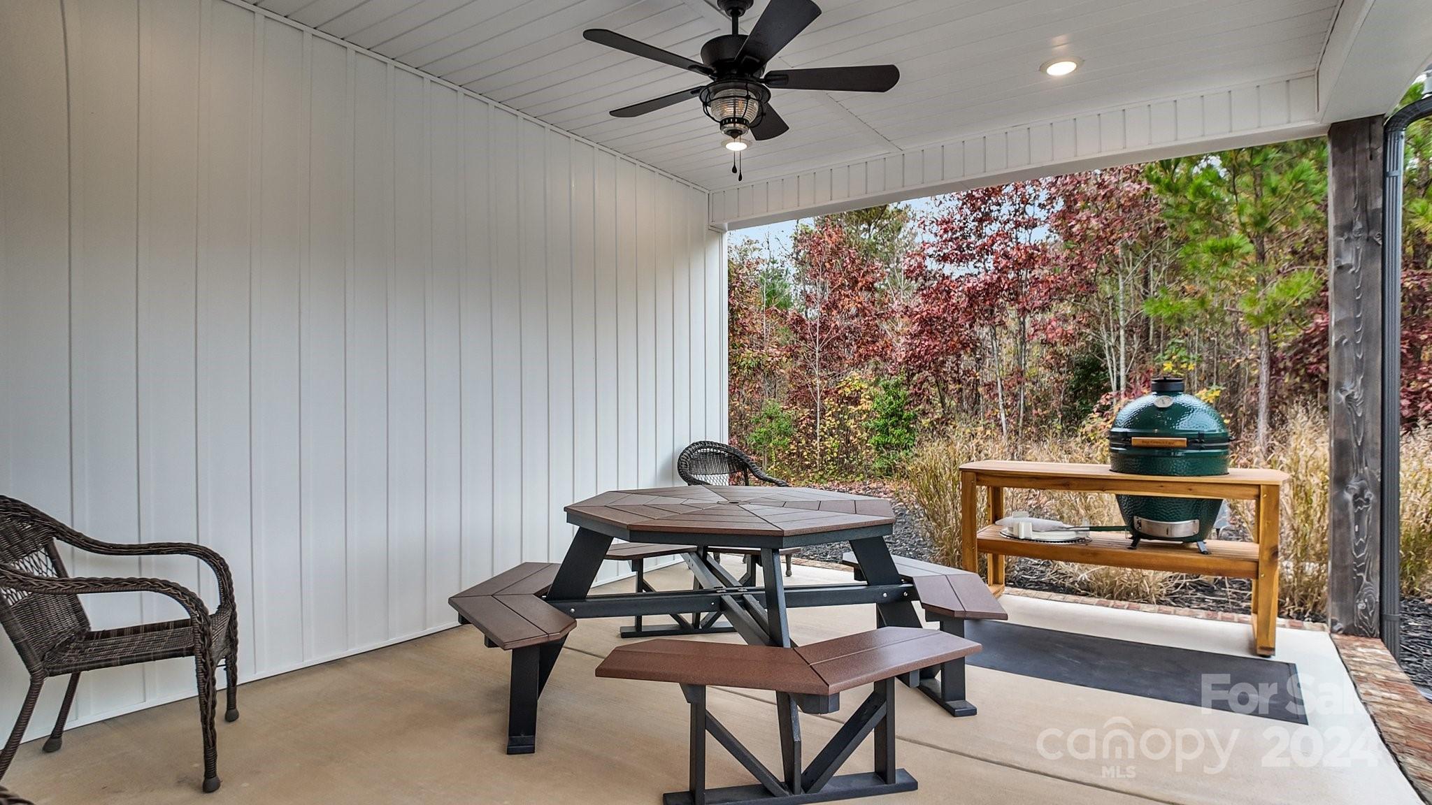 450 Bringle Ferry Road Denton, NC 27239 - Photo 44 of 48 a view of a workspace with furniture and a window