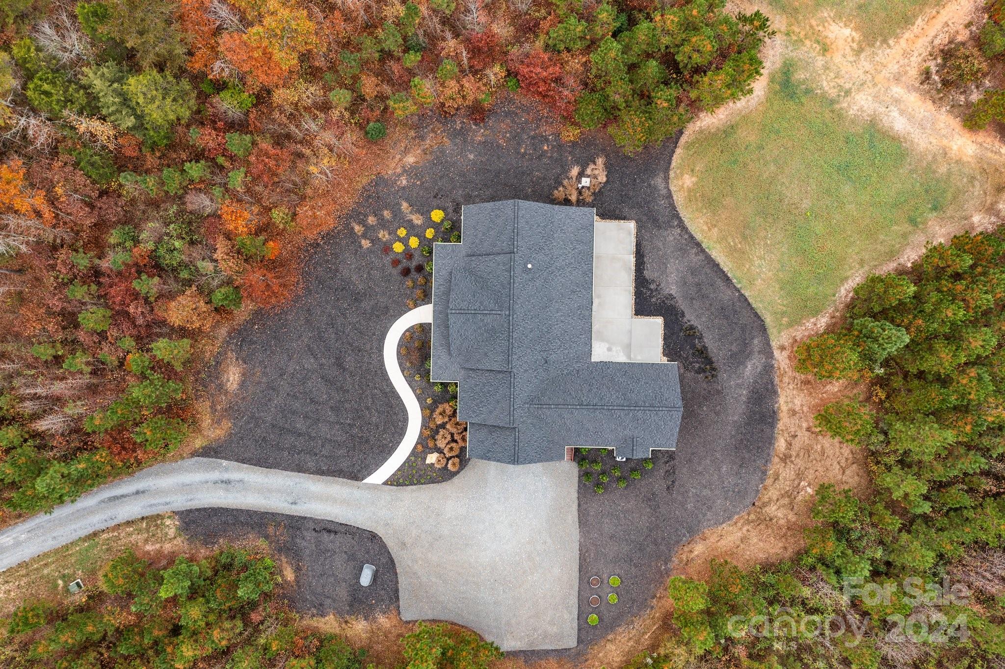 450 Bringle Ferry Road Denton, NC 27239 - Photo 7 of 48 an aerial view of a house with outdoor space