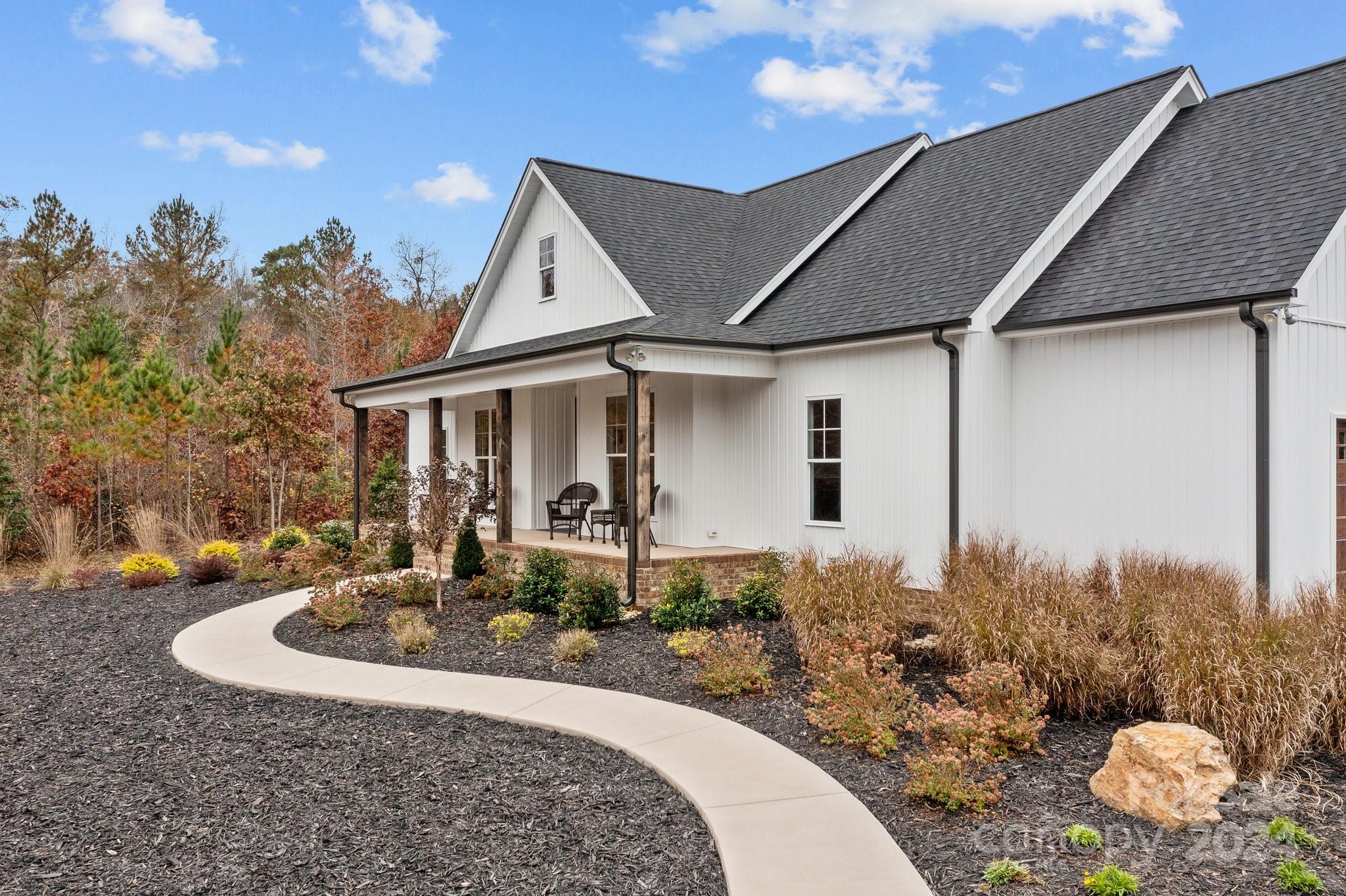 450 Bringle Ferry Road Denton, NC 27239 - Photo 9 of 48 a front view of a house with garden