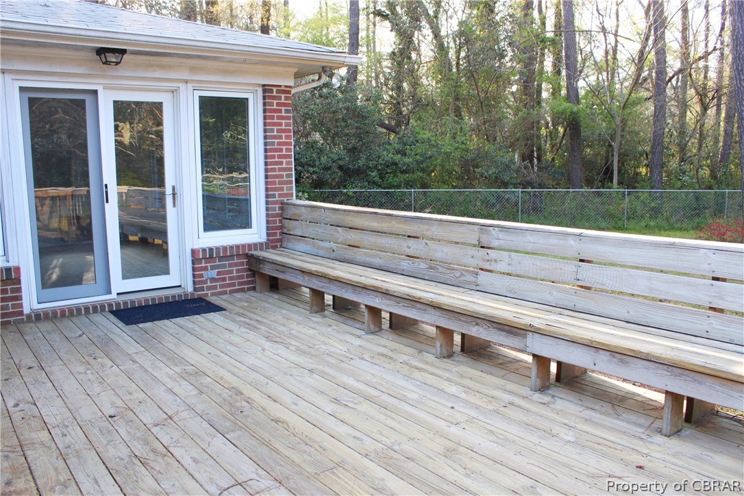 7449 Joseph Lewis Road Hayes, VA 23072 - Photo 16 of 32 Deck with built in seating great for entertaining and relaxing.
