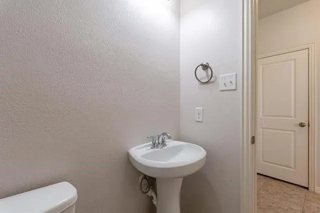 a view of staircase with white walls