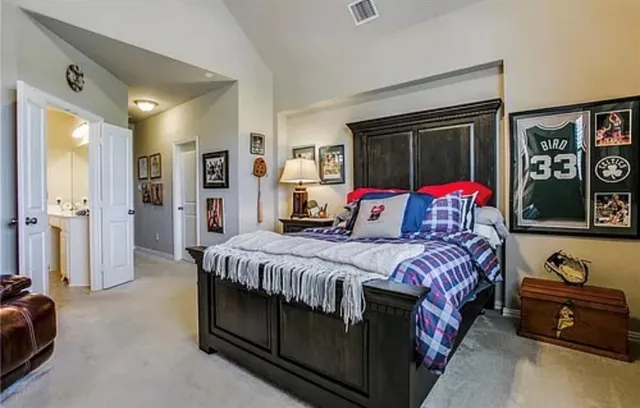 a bedroom with bed and windows