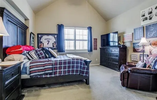 a en suite bathroom with a double vanity sink shower and a mirror