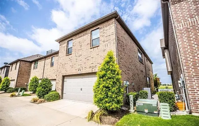 an aerial view of a house with a lake view