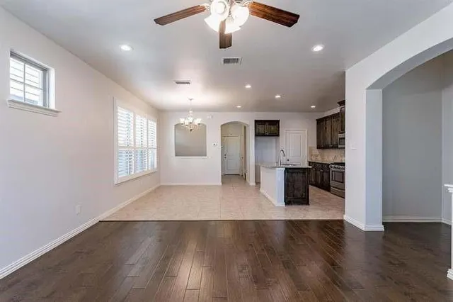 a kitchen with stainless steel appliances granite countertop a sink stove and microwave