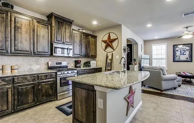 a kitchen with a table and chairs in it