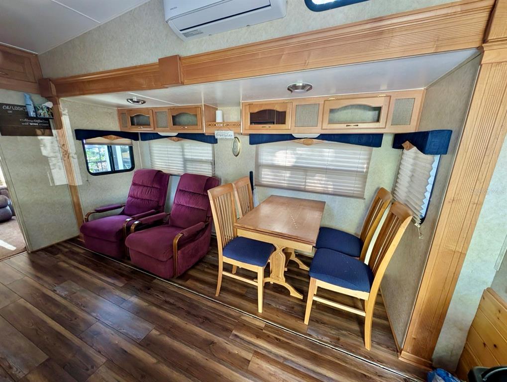 14131 Northeast 253rd Ave Road Salt Springs, FL 32134 - Photo 11 of 26 a living room with furniture and a wooden floor