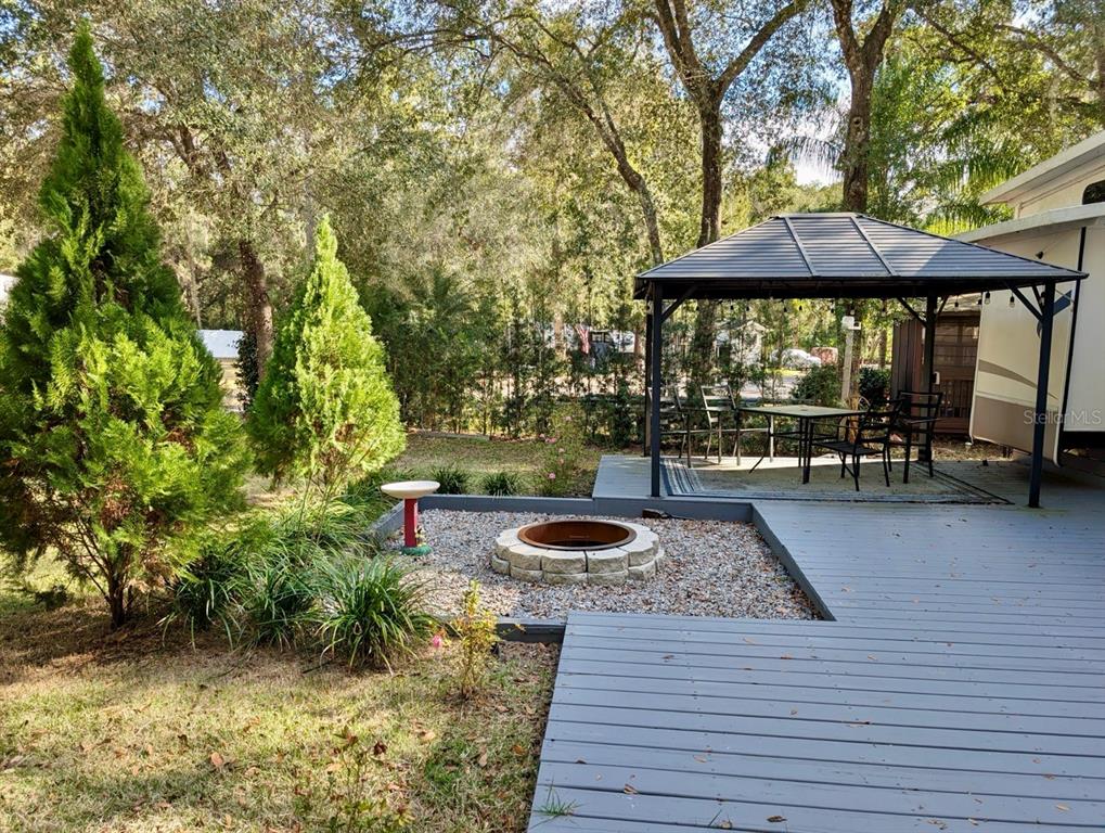 14131 Northeast 253rd Ave Road Salt Springs, FL 32134 - Photo 14 of 26 an outdoor space with furniture