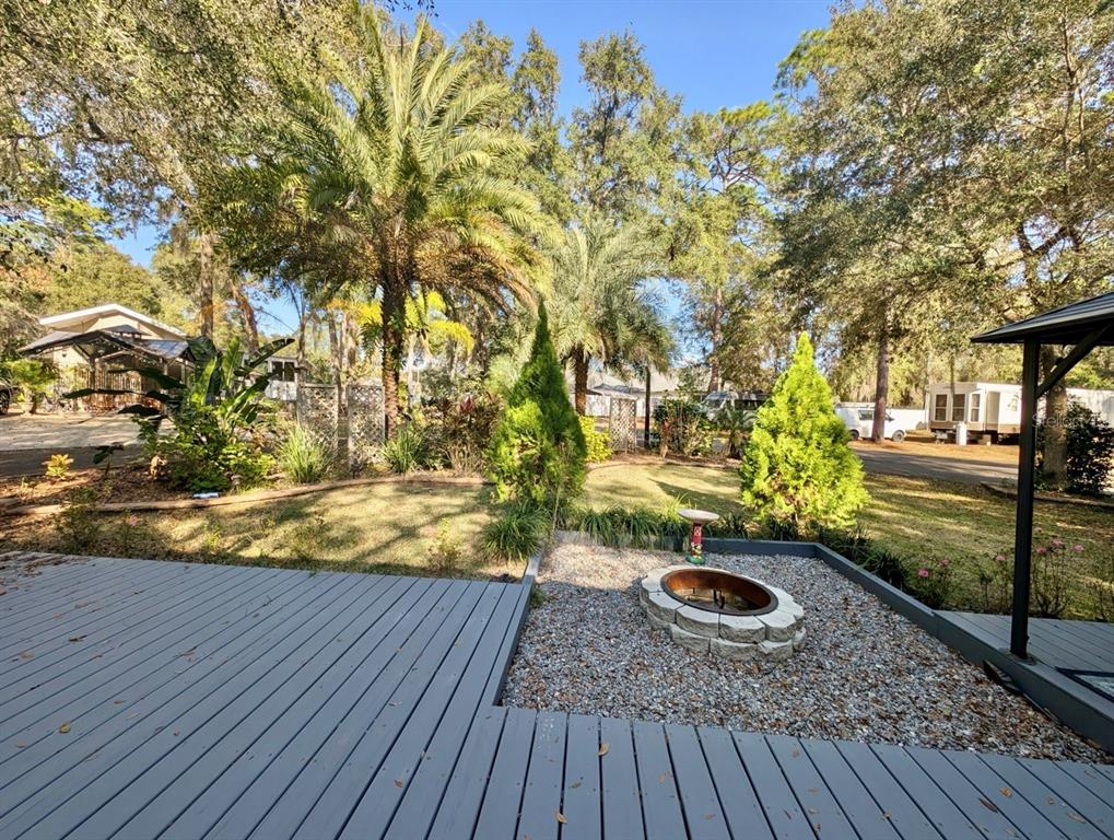 14131 Northeast 253rd Ave Road Salt Springs, FL 32134 - Photo 16 of 26 a view of outdoor space and deck with large trees
