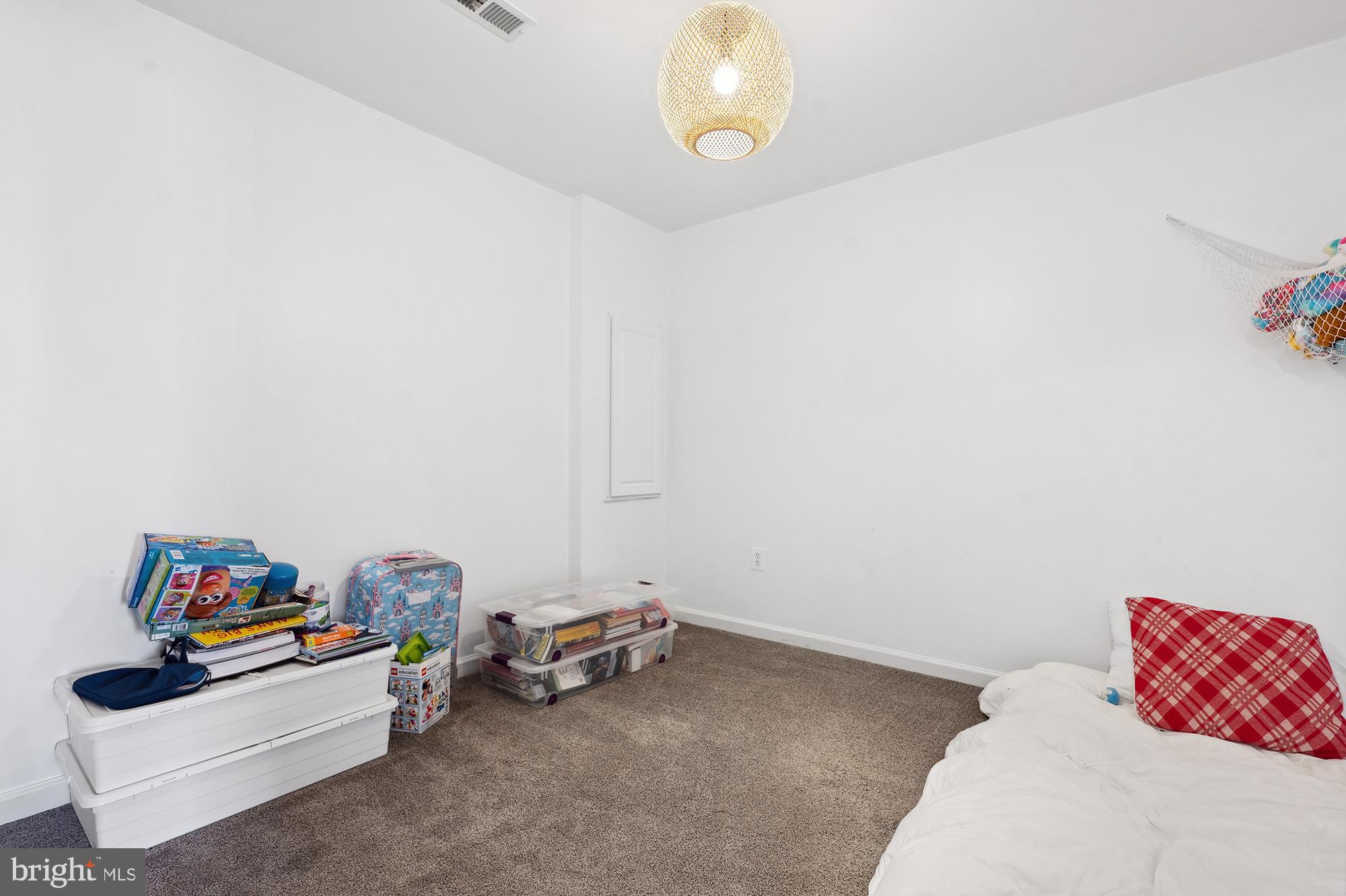 3663 Singleton Terrace Frederick, MD 21704 - Photo 25 of 34 a view of a room with toys and a ceiling fan