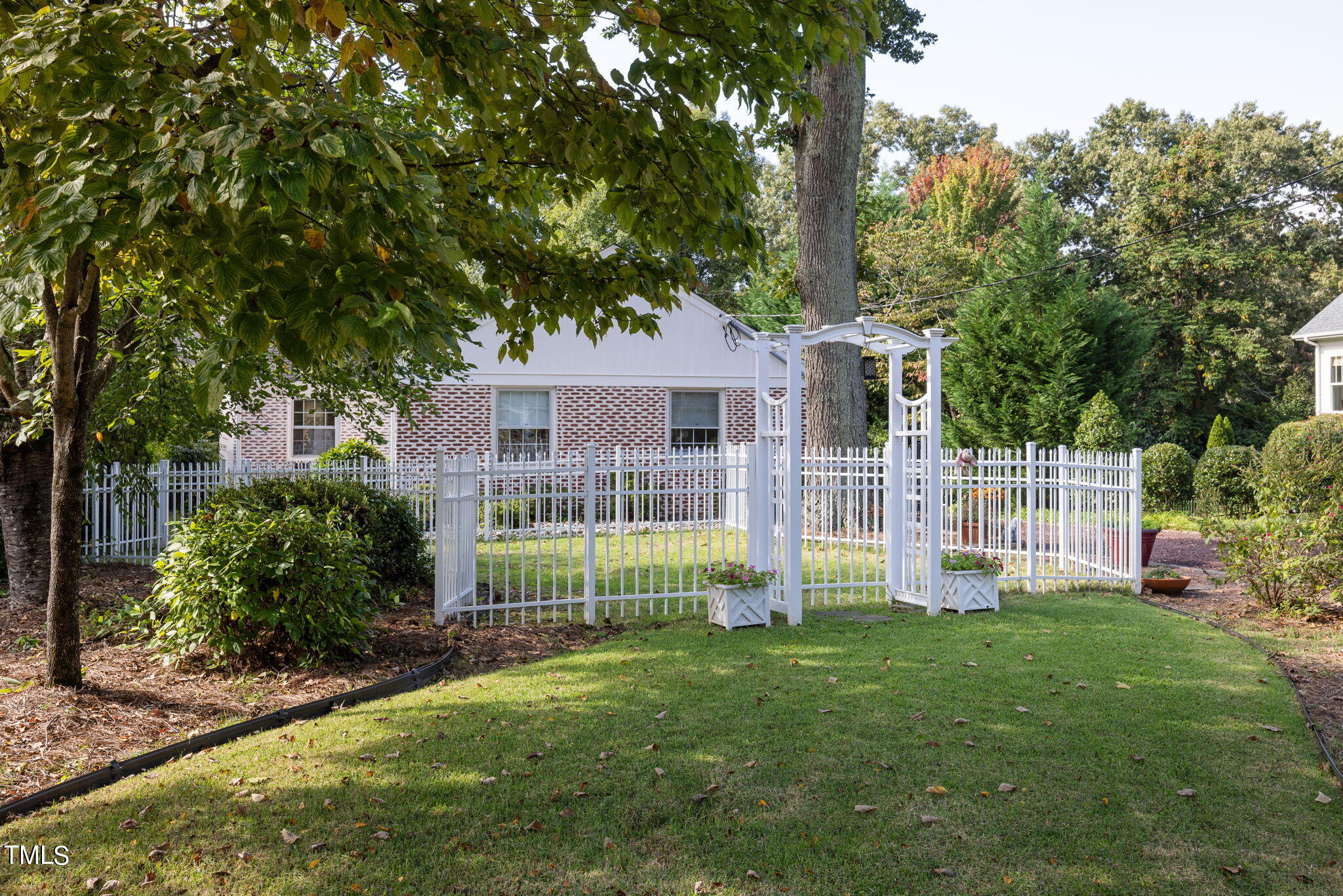 3409 Lewis Farm Road Raleigh, NC 27607 - Photo 1 of 31 a view of house with a big yard and potted plants