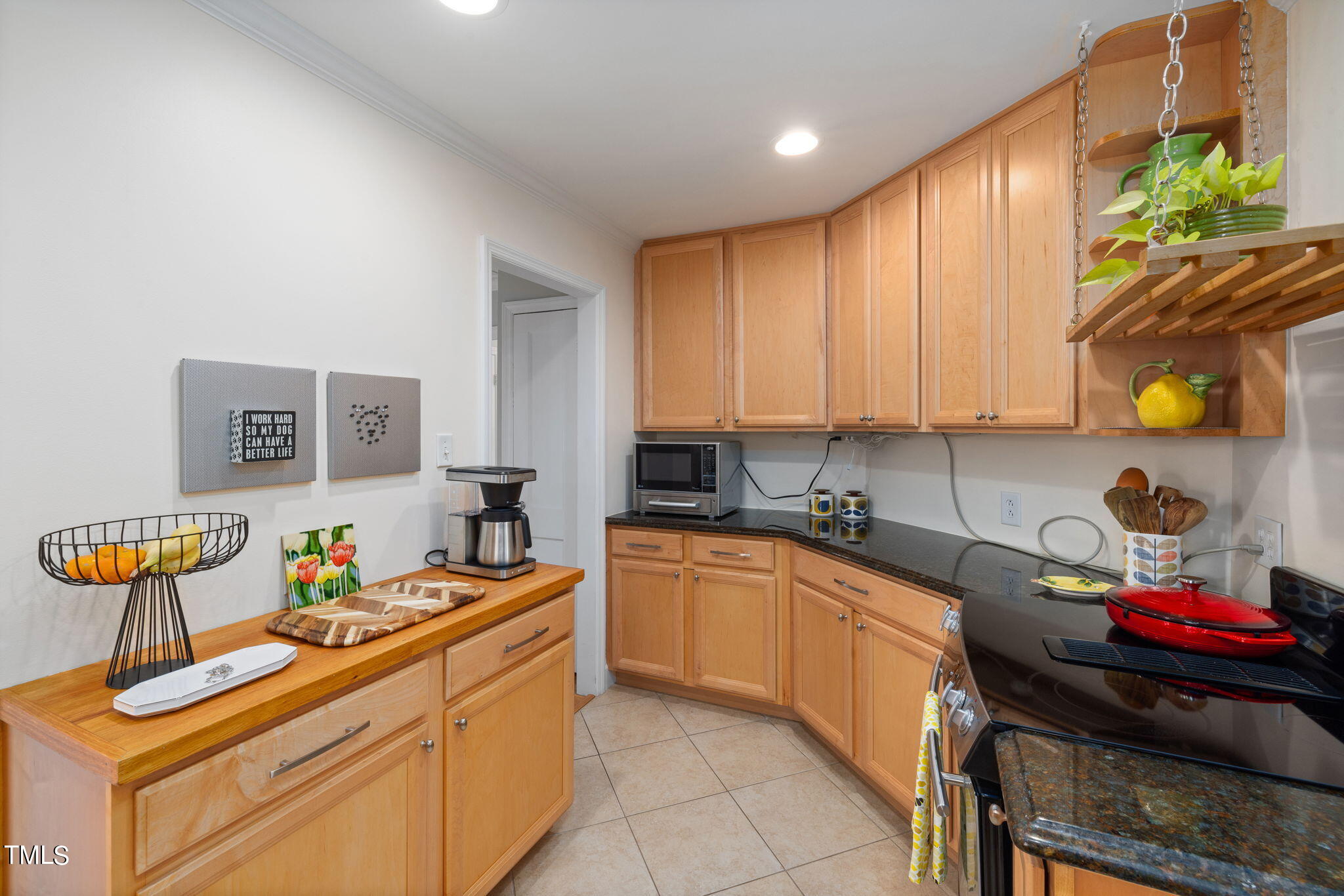 3409 Lewis Farm Road Raleigh, NC 27607 - Photo 12 of 31 a kitchen with a sink and cabinets