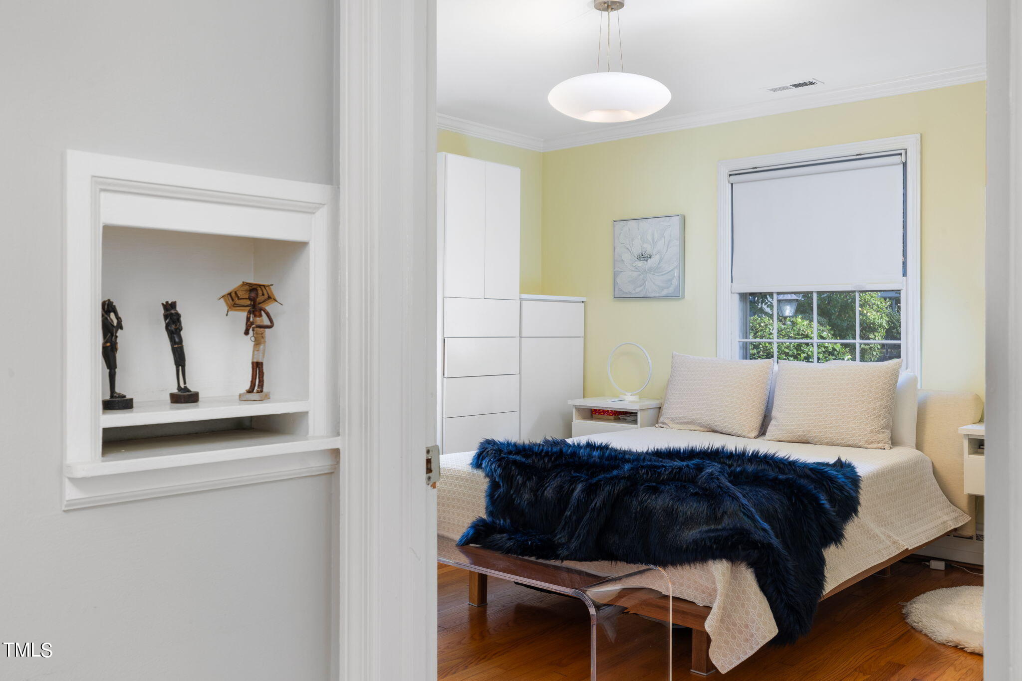 3409 Lewis Farm Road Raleigh, NC 27607 - Photo 13 of 31 a bedroom with a bed and a painting on the wall