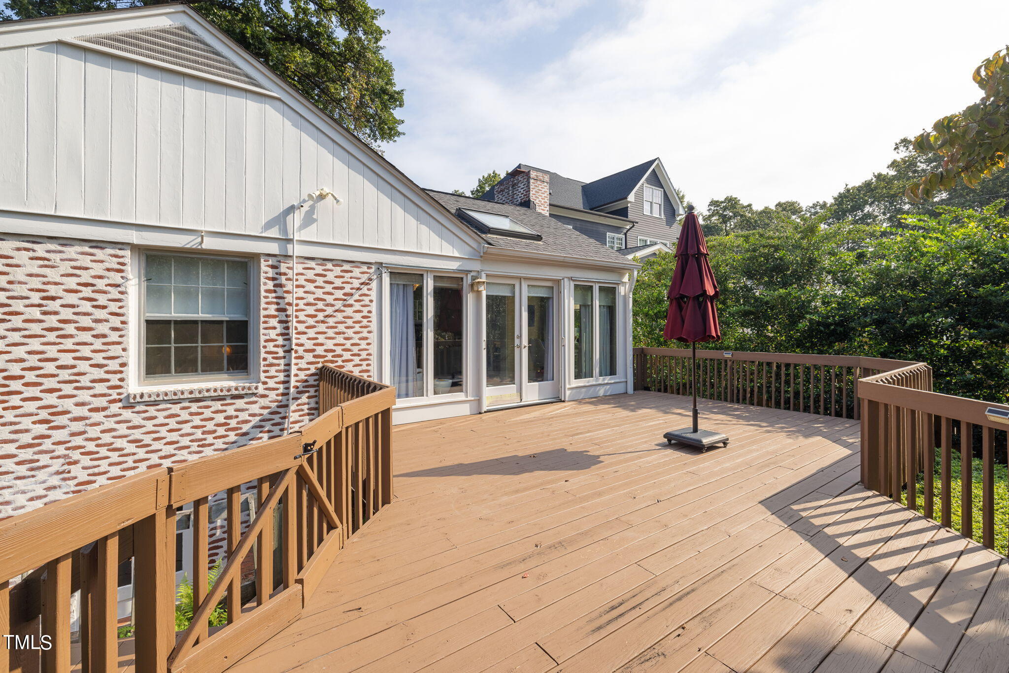 3409 Lewis Farm Road Raleigh, NC 27607 - Photo 24 of 31 a view of a house with wooden deck and furniture