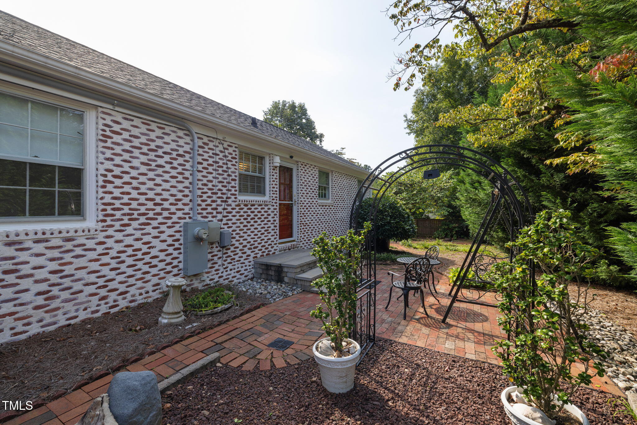 3409 Lewis Farm Road Raleigh, NC 27607 - Photo 26 of 31 a view of a patio with table and chairs and potted plants