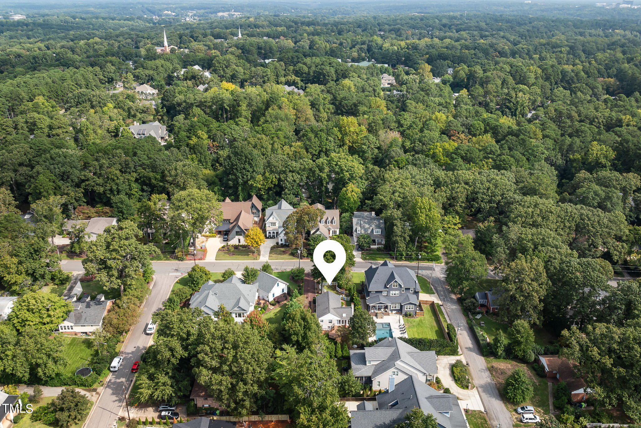 3409 Lewis Farm Road Raleigh, NC 27607 - Photo 27 of 31 an aerial view of house with yard and outdoor seating