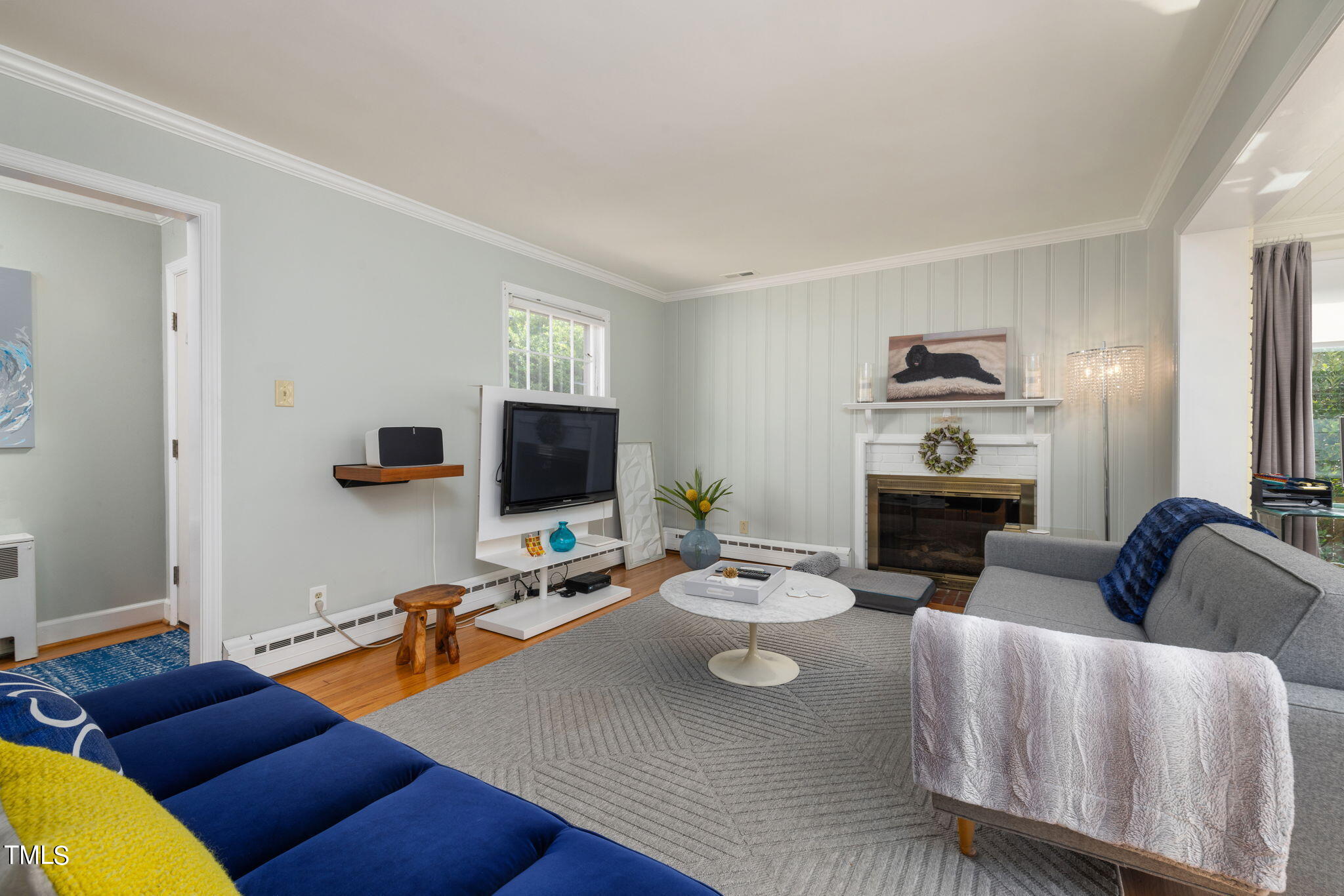 3409 Lewis Farm Road Raleigh, NC 27607 - Photo 5 of 31 a living room with furniture and a flat screen tv