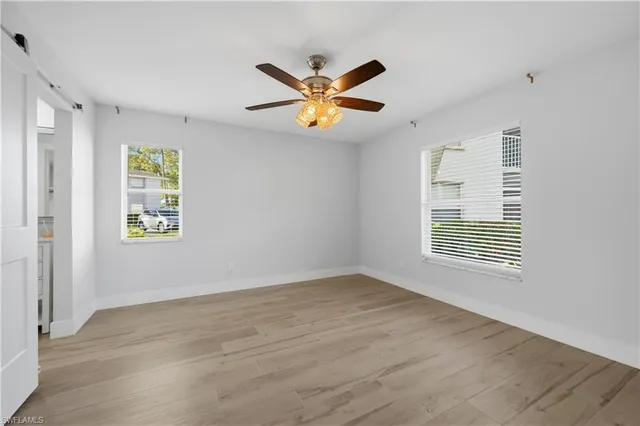 a view of an empty room with a window