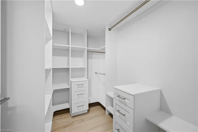 a view of an empty walk in closet